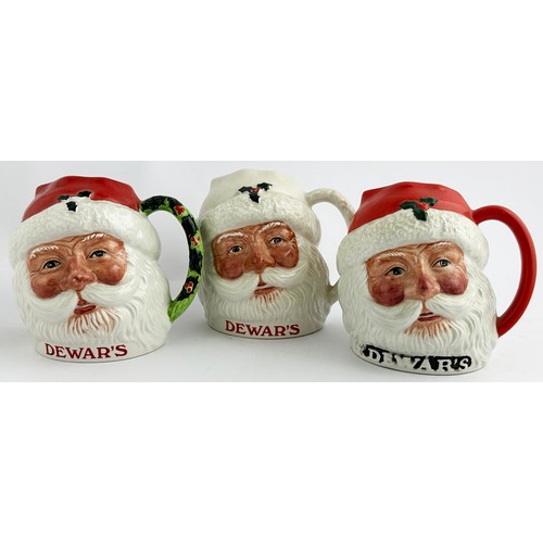 11 - DEWARS SANTA CLAUS JUG TRIO. 4.4ins tall. Three variations of a jovial looking Santa jug, pouring li... 