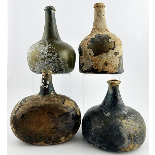 49 - WINE BOTTLES GROUP. Tallest 7 ins. Various shapes and sizes, iridescent. All damaged. (4) 5/10 Unsui... 