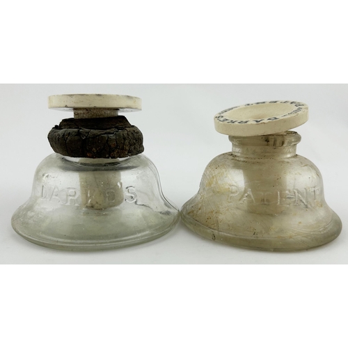 357 - DARKES INKWELL DUO. 3ins tall. Clear glass embossed base with porcelain topper. Damages. (2)