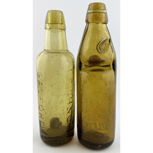 527 - GLOBE CODD & BULLET STOPPER BOTTLES. Tallest 9ins, both 10oz. Light amber Leigh & Co bullet (a few m... 