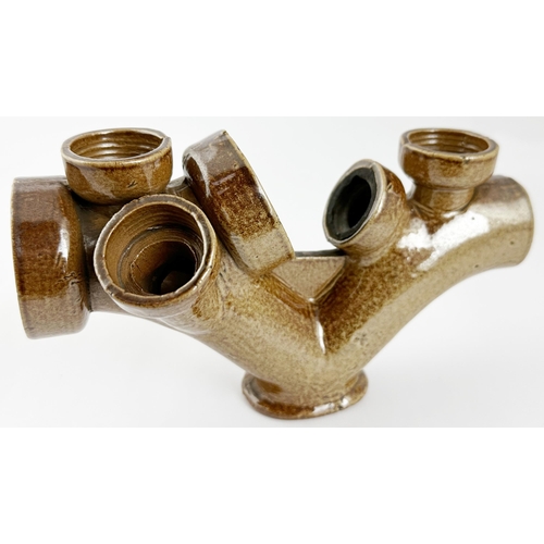 539 - TRADESMANS SAMPLE BUILDERS PIPE. 7.2ins wide, 4.5ins tall. A quite complex shiny salt glaze form, on... 