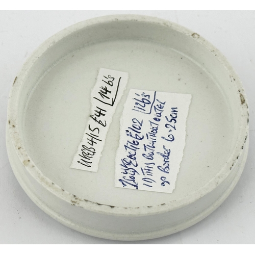 565 - LONDON POT LID. (APL pg 282, 108a) 2.8ins diam. Decorative border, crown pictorial t.m. to centre. C... 