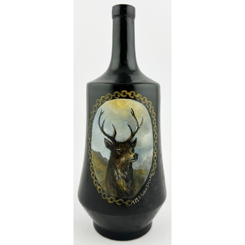 134 - THORNES WHISKY BOTTLE. 9.25ins tall. Featuring a painstakingly hand painted stag. No damage.