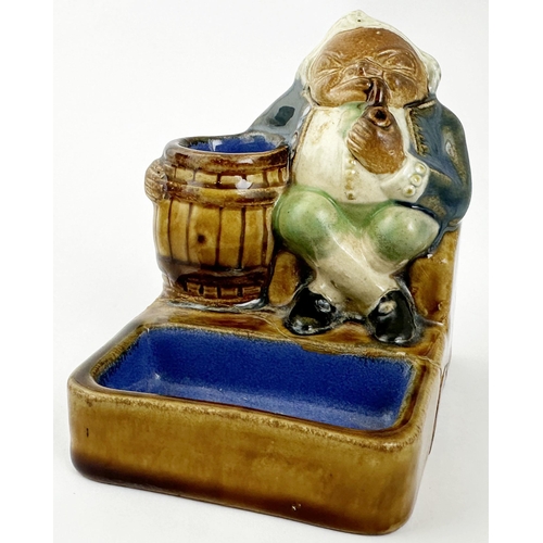 426 - DOULTON LAMBETH MATCHSTRIKER & ASHTRAY. 3.9ins tall, 3.7 x 3ins base. Salt glazed stoneware, multico... 