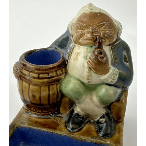 426 - DOULTON LAMBETH MATCHSTRIKER & ASHTRAY. 3.9ins tall, 3.7 x 3ins base. Salt glazed stoneware, multico... 