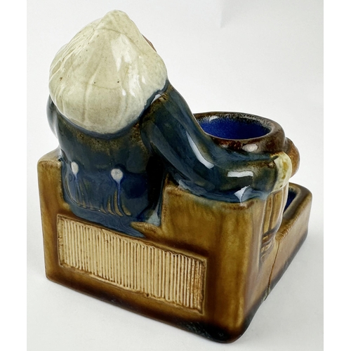 426 - DOULTON LAMBETH MATCHSTRIKER & ASHTRAY. 3.9ins tall, 3.7 x 3ins base. Salt glazed stoneware, multico... 