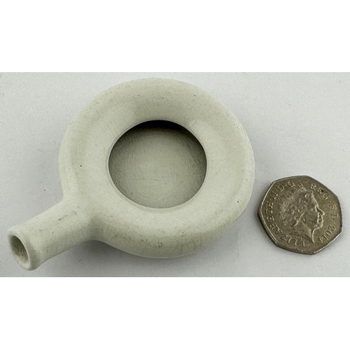 447 - MINIATURE TRADEMANS SAMPLE HOSPITAL BEDPAN. 3.2ins long. Simple white glazed cast ceramic bedpan, so... 