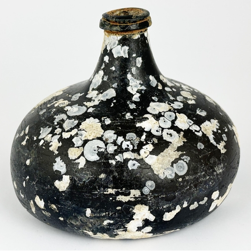 457 - ENGLISH ONION WINE BOTTLE. 5ins tall. Classic English onion form. Heavy. Dark black glass superbly a... 