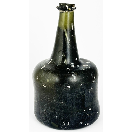 462 - ENGLISH MALLET WINE BOTTLE. 8.2ins tall. Black glass. Few string rim nibbles, crude shoulder indent,... 