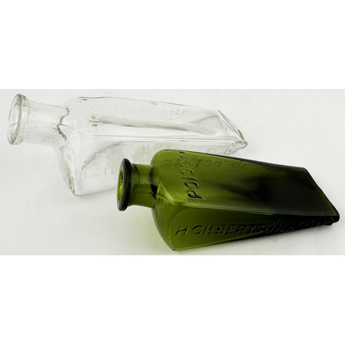 469 - GILBERTSONS WEDGE PATENT POISON BOTTLE. (DP p22). Mid green glass wedge shape gradating to dark gree... 