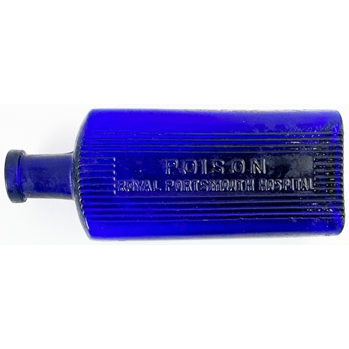 490 - PORTSMOUTH ROYAL HOSPITAL POISON BOTTLE. (DP p115) 5.3ins tall. Cobalt blue rectangular. Front embos... 