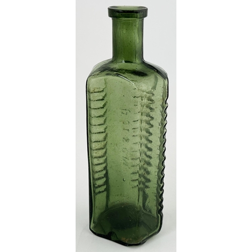 495 - ETON STAR POISON BOTTLE. (DP p58) 6.2ins tall. Green glass, narrow neck. Embossed POISON NOT TO BE T... 