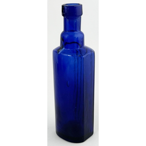 496 - POISON BOTTLE. 4.9ins tall. Cobalt blue, horizontally ribbed to front with rounded back. Underneath ... 