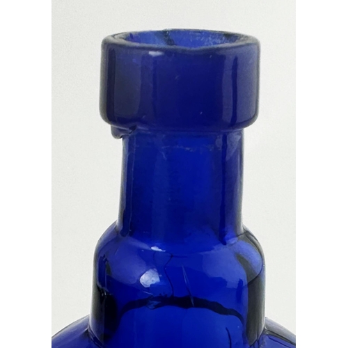 496 - POISON BOTTLE. 4.9ins tall. Cobalt blue, horizontally ribbed to front with rounded back. Underneath ... 