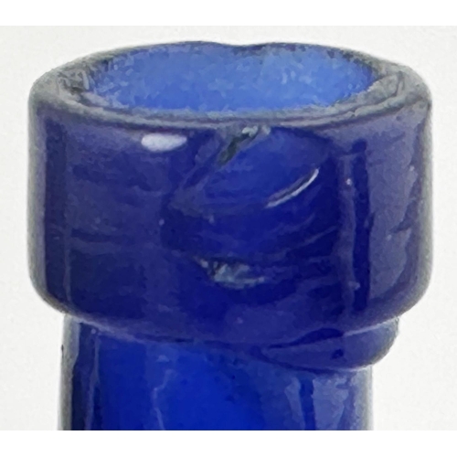 496 - POISON BOTTLE. 4.9ins tall. Cobalt blue, horizontally ribbed to front with rounded back. Underneath ... 