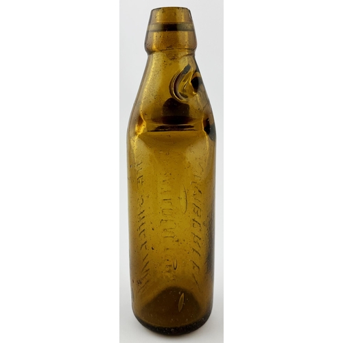 379 - SOUTH AFRICAN COLOURED CODD BOTTLE. 9ins tall. Mid amber glass THE SHILLING/ AERATED FACTORY/ KIMBER... 