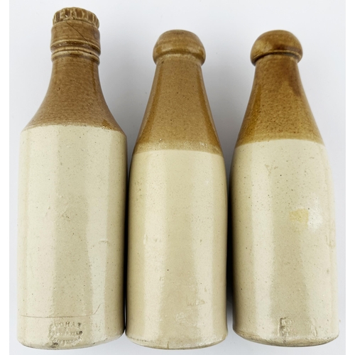 383 - CUMBRIA GINGER BEER BOTTLE TRIO. 8.5ins tallest. T.t, 2 blop top, 1 square screw lip c.h. Strong bla... 