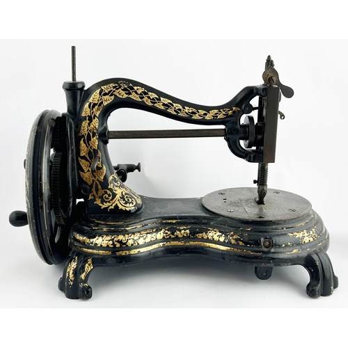 287 - SEWING MACHINE. 15 x 10ins. Black & gold decorative machine. Worn. 7/10 Unsuitable for p+p