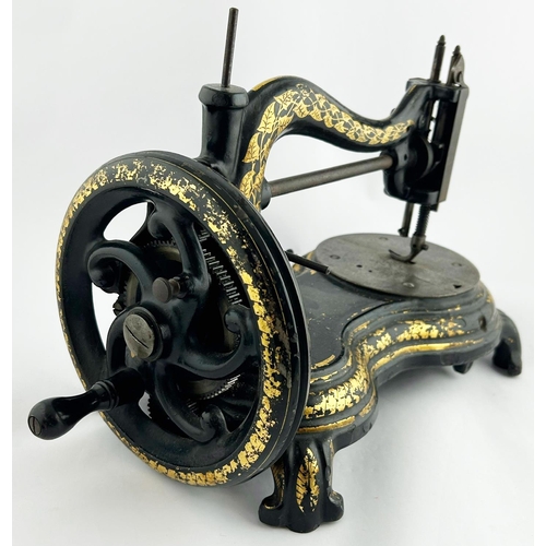 287 - SEWING MACHINE. 15 x 10ins. Black & gold decorative machine. Worn. 7/10 Unsuitable for p+p