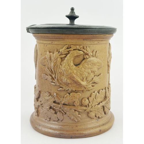 306 - NAPOLEON TOBACCO JAR. 6.25ins tall. Pewter lid ? Heavily sprigged with leaves, Napoleon & bird. Lid ... 