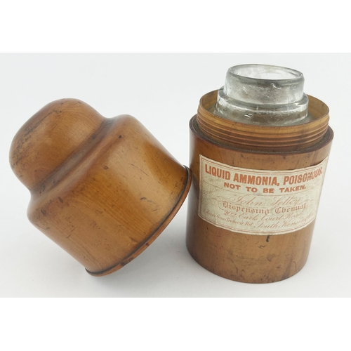 321 - 6 321. KENSINGTON WOODEN AMMONIA CASE with bottle. 5.25ins. Paper label on outside with glass poison... 