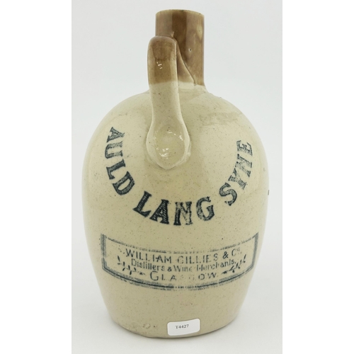 332 - GLASGOW AULD LANG SYNE WHISKY JUG. 7.25ins tall. Image to front, rear distillers name. Lip nicks.