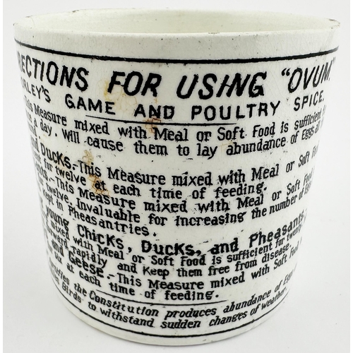 366 - OVUM POULTRY FOOD MUG. 2.8 ins tall. Straight sided mug shape. Detailed chicken one side atop an egg... 