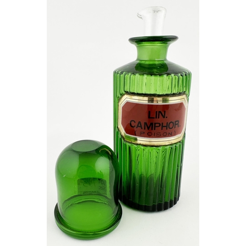 392 - PHARMACY SHOP ROUND BOTTLE. 7.5ins tall. Bright green glass, circular, vertical ribs all round. Red ... 