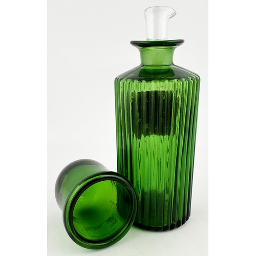 392 - PHARMACY SHOP ROUND BOTTLE. 7.5ins tall. Bright green glass, circular, vertical ribs all round. Red ... 