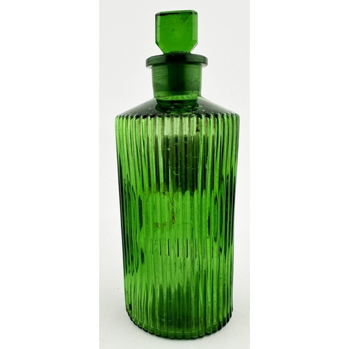 393 - PHARMACY SHOP ROUND BOTTLE. 8ins tall. Bright green glass, circular, vertical ribs all round, ground... 