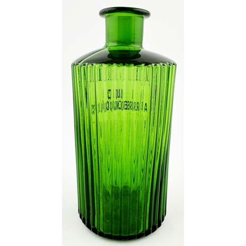 396 - PHARMACY SHOP ROUND BOTTLE. 7.9ins tall. Bright green glass, circular, vertical ribs all round, grou... 