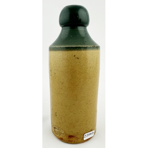 421 - SAM HORNSBY PLYMOUTH GINGER BEER BOTTLE. 6.9ins tall, std, t.t., cork closure, bluey green top, ligh... 