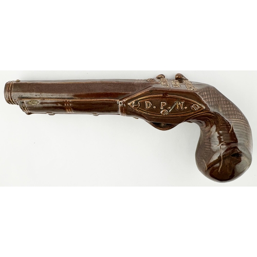 438 - DEWARS PERTH WHISKY PISTOL SHAPED FLASK. WG p57. Shiny brown glazed very detailed flintlock shaped f... 