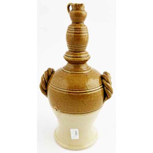 460 - stoneware money box topped with a jug and spigotted barrel shape, two rope effect side handles. Blac... 