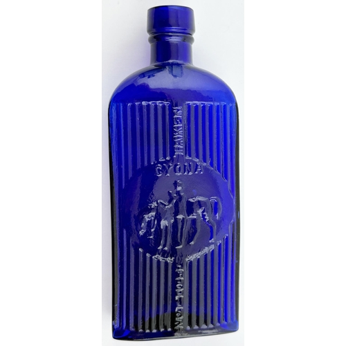 508 - CYONA POISON BOTTLE. 5.7ins tall. Deep/ bright cobalt blue glass, strap sided, oval base. Deeply emb... 