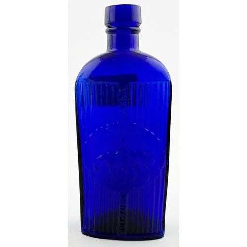 508 - CYONA POISON BOTTLE. 5.7ins tall. Deep/ bright cobalt blue glass, strap sided, oval base. Deeply emb... 