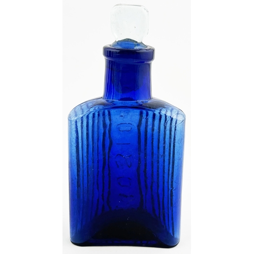 514 - TRIANGULAR POISON BOTTLE. 5ins tall. Cobalt glass. Triangular shape with rounded rear corners, 2 fro... 