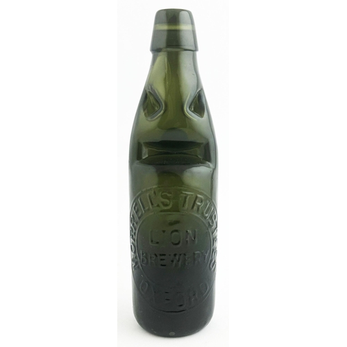 533 - MORRELLS TRUSTEES LION BREWERY CODD BOTTLE. 9.1ins tall. Very dark green, nearly black, Niagara pate... 