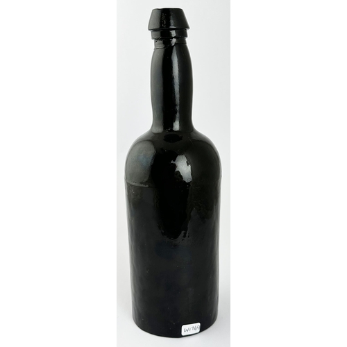 564 - T C SEALED THREE PIECE WINE BOTTLE. 11.3 ins tall. Black glass, 3 part mould, very winky/ crude neck... 