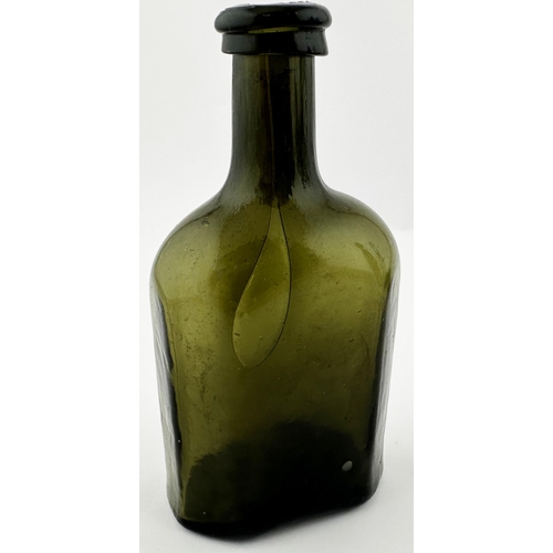 565 - ENGLISH FREEBLOWN UTILITY BOTTLE. 5 ins tall. Very dark green/ black glass. Rectangular base, facett... 