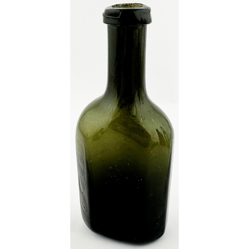 566 - ENGLISH FREEBLOWN UTILITY BOTTLE. 6 ins tall. Very dark green/ black glass. Rectangular base, facett... 