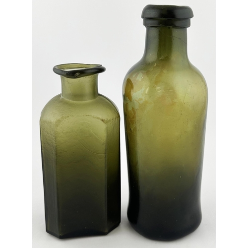 567 - PAIR OF EARLY UTILITY BOTTLES. Tallest 7.5 ins tall. An interesting duo of dark green freeblown bott... 