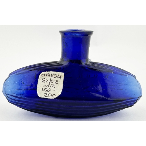 568 - SUBMARINE POISON BOTTLE. DP pg 24. 2.4ins tall, 4ins long, cobalt blue glass. Classic familiar uniqu... 