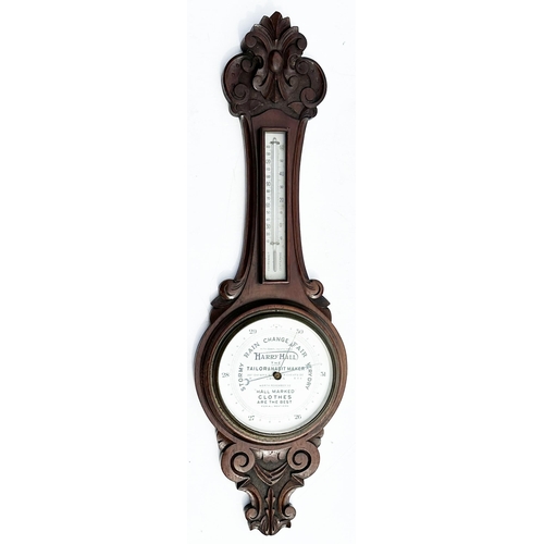 16 - HARRY HALL BAROMETER. 34.5ins tall. Early twentieth century carved oak encased aneroid wheel baromet... 