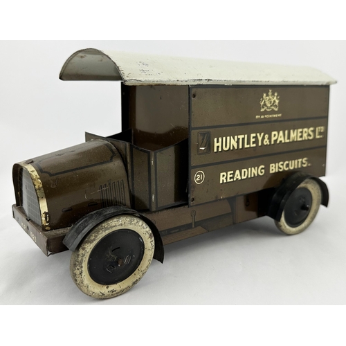 38 - HUNTLEY & PALMERS BISCUITS TIN LORRY. 9.5ins long. Lithographed four wheeled, open fronted, lettered... 