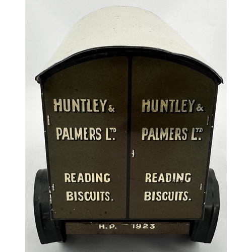 38 - HUNTLEY & PALMERS BISCUITS TIN LORRY. 9.5ins long. Lithographed four wheeled, open fronted, lettered... 