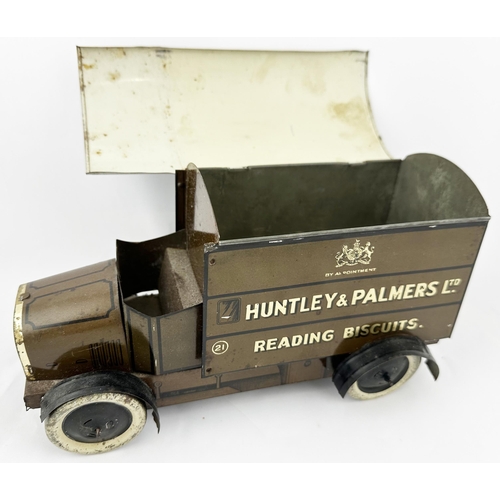 38 - HUNTLEY & PALMERS BISCUITS TIN LORRY. 9.5ins long. Lithographed four wheeled, open fronted, lettered... 