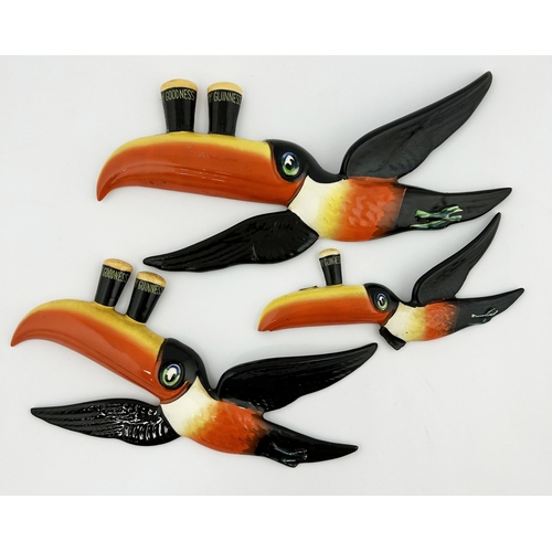 43 - GUINNESS FLYING TOUCAN CERAMIC WALL PLAQUES. Longest 10ins. Set of three classic multi coloured flyi... 