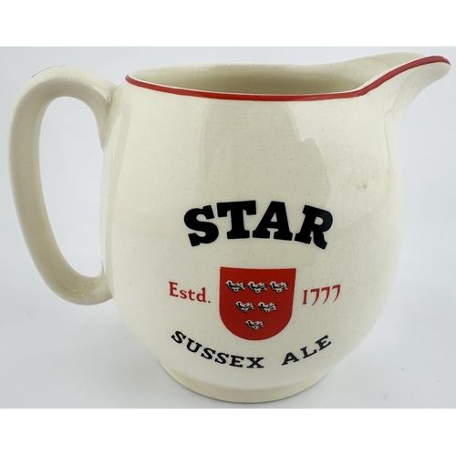 61 - STAR SUSSEX ALE JUG. 4.6ins tall. White ceramic, red and black transfer both sides. Light body crazi... 