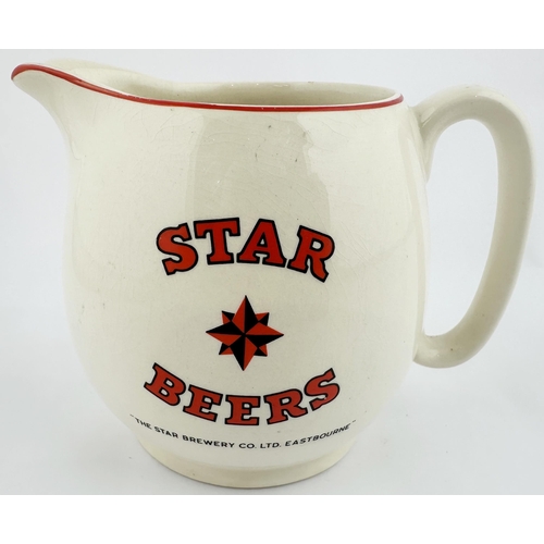 61 - STAR SUSSEX ALE JUG. 4.6ins tall. White ceramic, red and black transfer both sides. Light body crazi... 